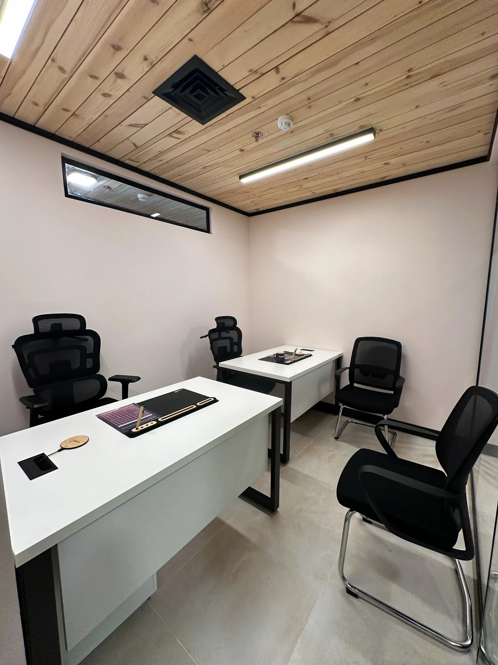 Office 1 · two desks with ergonomic chairs, two visitor chairs and a wooden ceiling