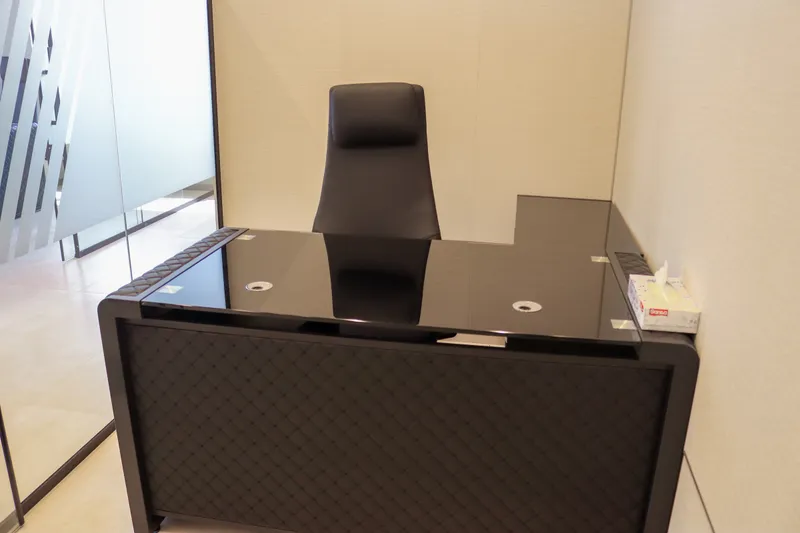 Office 59 · L-shaped desk and high-back chair