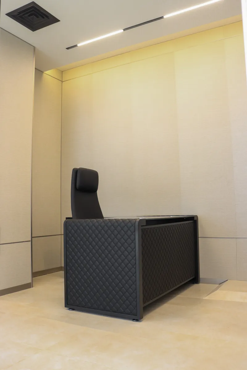 Office 58 · desk and high-back chair against a panelled wall