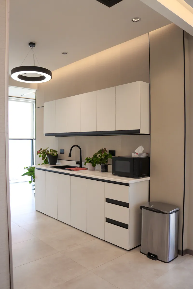 13th floor · pantry with wall cabinets, sink and microwave under a ring pendant