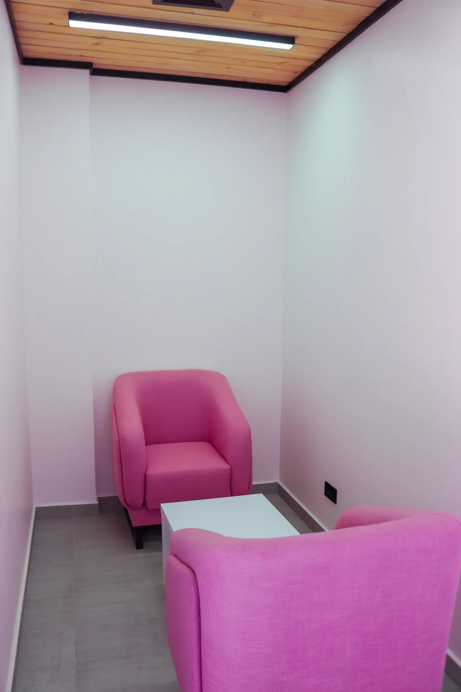 Huddle · two armchairs and a small white table, 14th floor