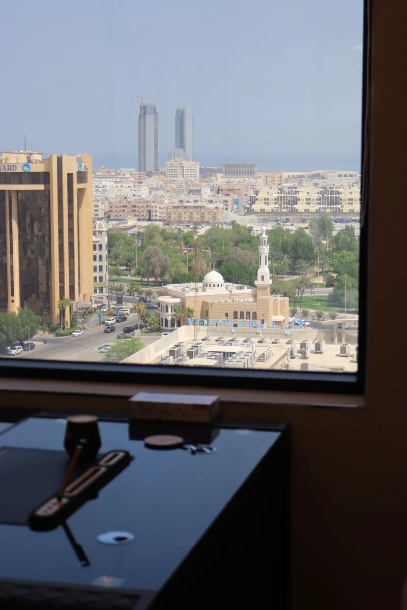 Office 57 · view from the window over the city, a mosque and distant towers