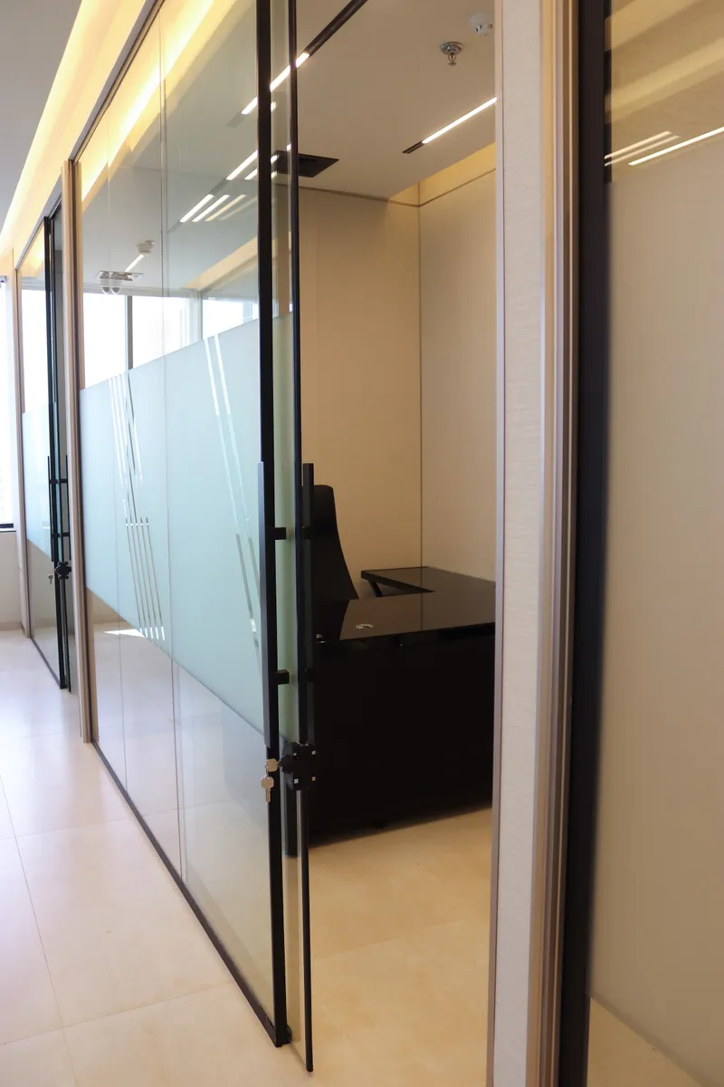 Office 59 · open glass door and frosted glass front seen from the corridor