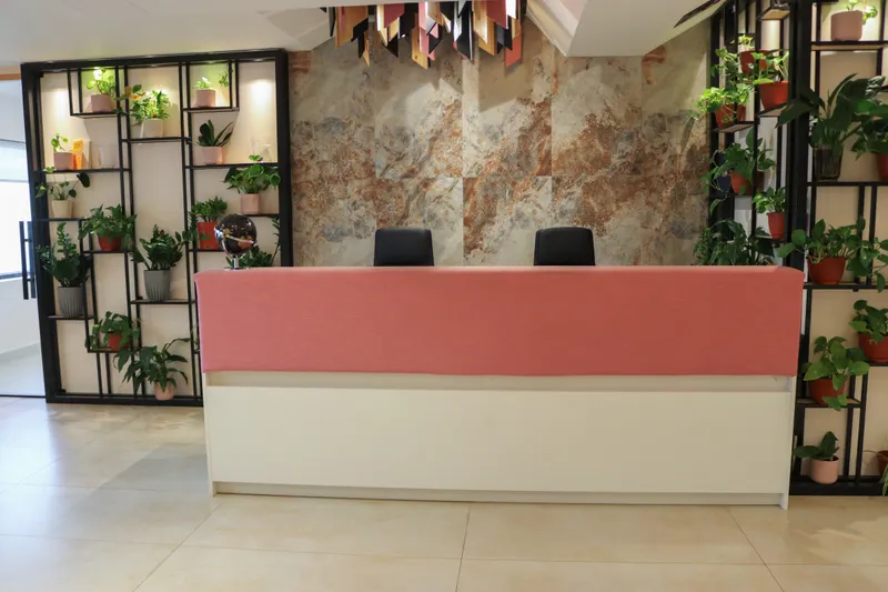 2nd floor · reception desk with plant shelving and a stone-effect feature wall