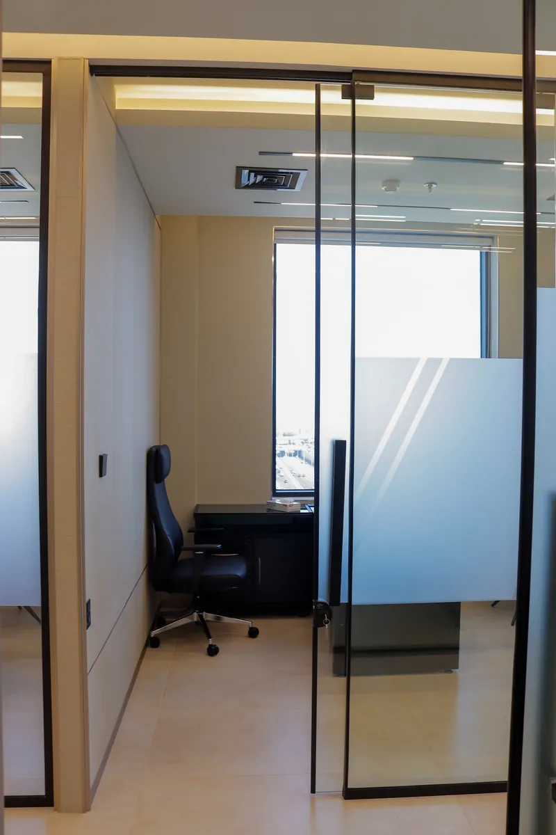 Office 54 · glass sliding door opening onto the office