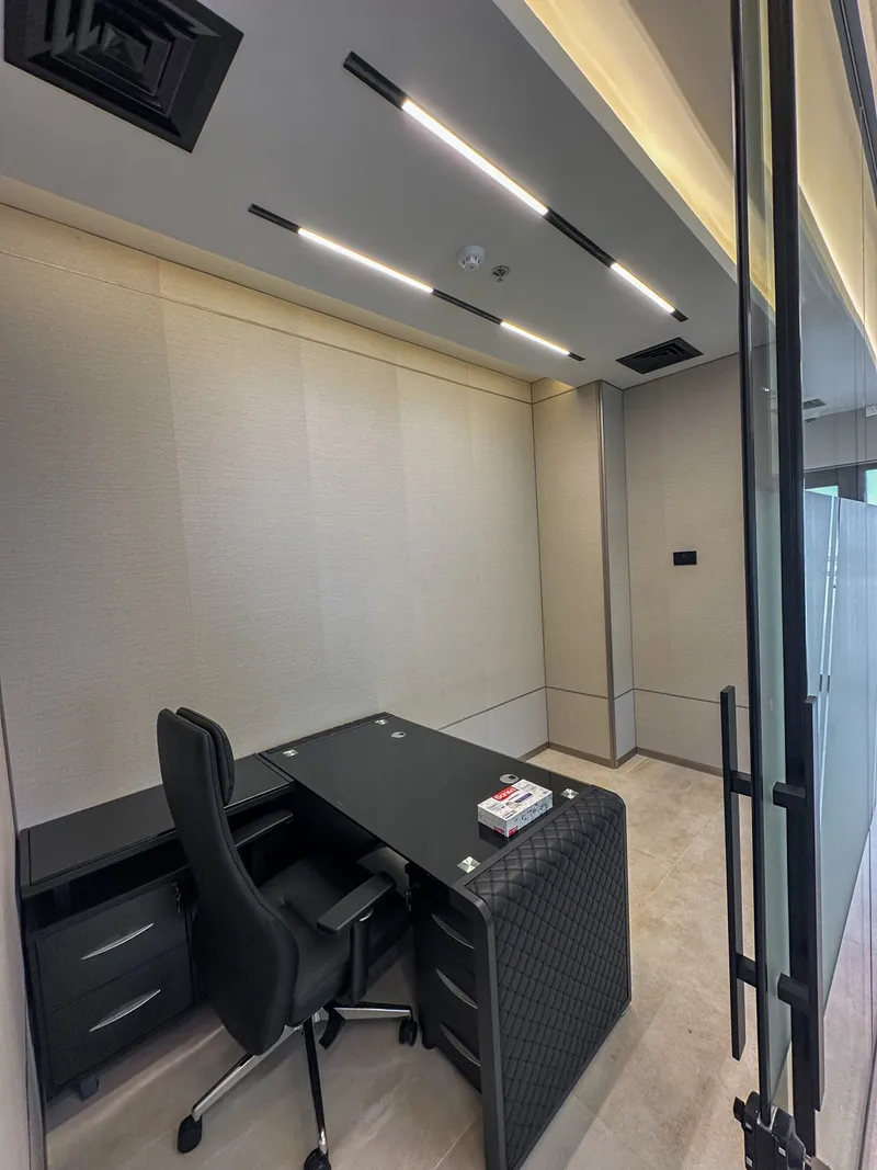 Office 61 · desk with drawer pedestals, swivel chair and linear ceiling lights