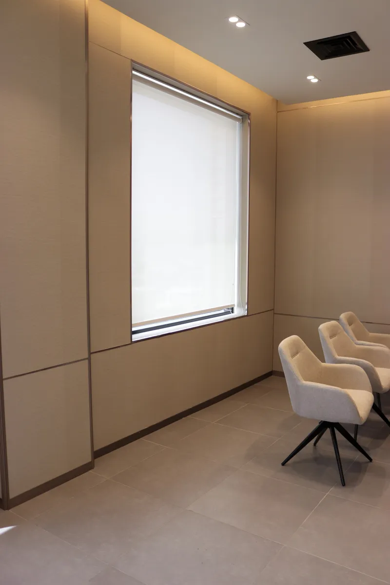 The Momentum Hall · window with a roller blind behind the seating rows
