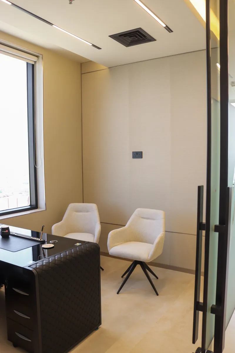 Office 54 · two guest armchairs across from the desk