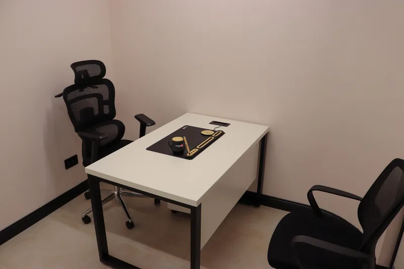 Office 32 · white desk with a high-back mesh chair and a visitor chair